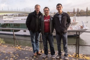 MIT COP23 representatives (l-r) Michael Casey of MIT Sloan,undergraduate student Erick Pinos, and graduate student Stephen Lee convene at the riverboat where the "Hack for Climate" side event was held. The hackathon brought together developers to explore blockchain and other digital ledger technologies for climate solutions. (Photo: Emily Dahl)